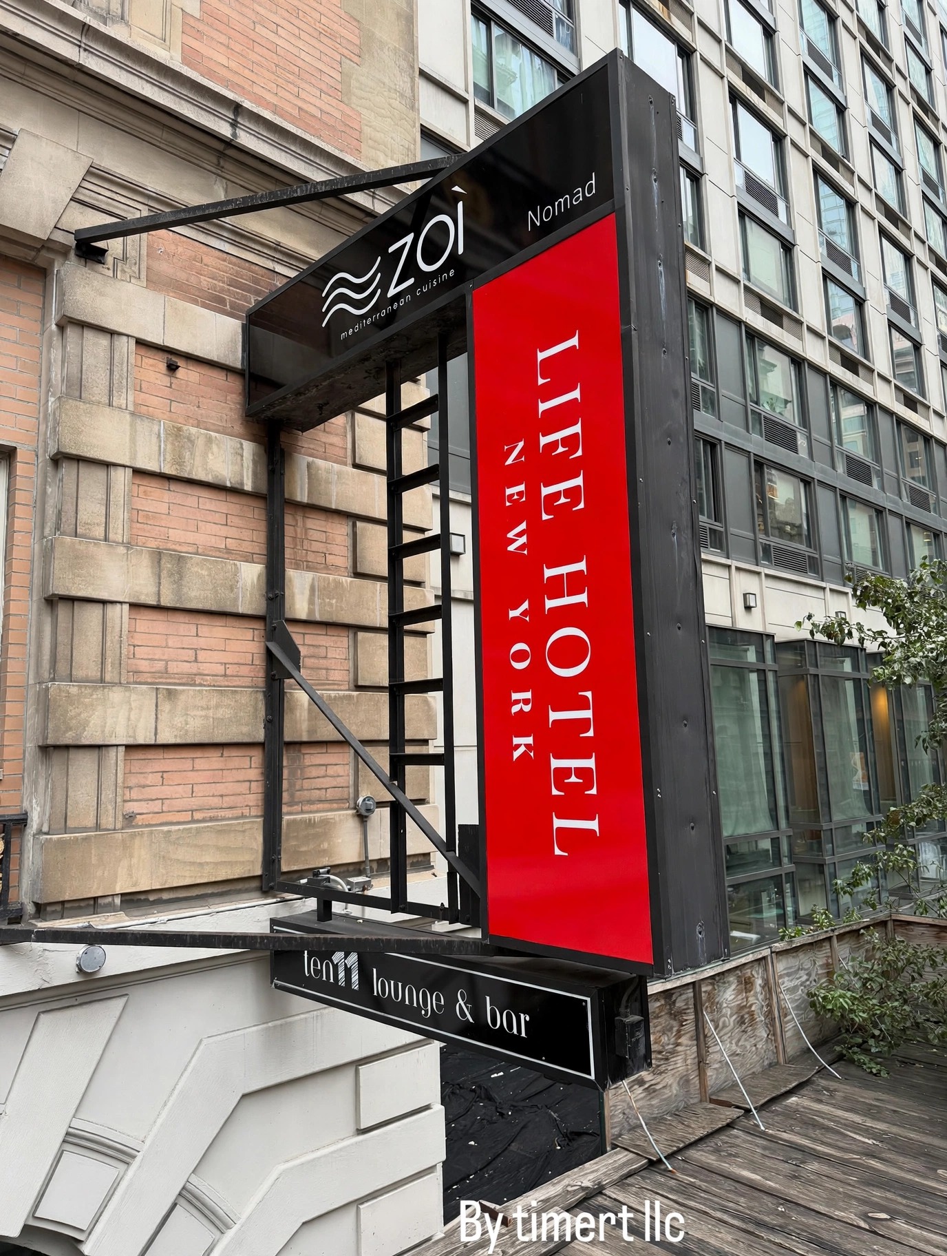 Projecting blade sign for a hotel entrance