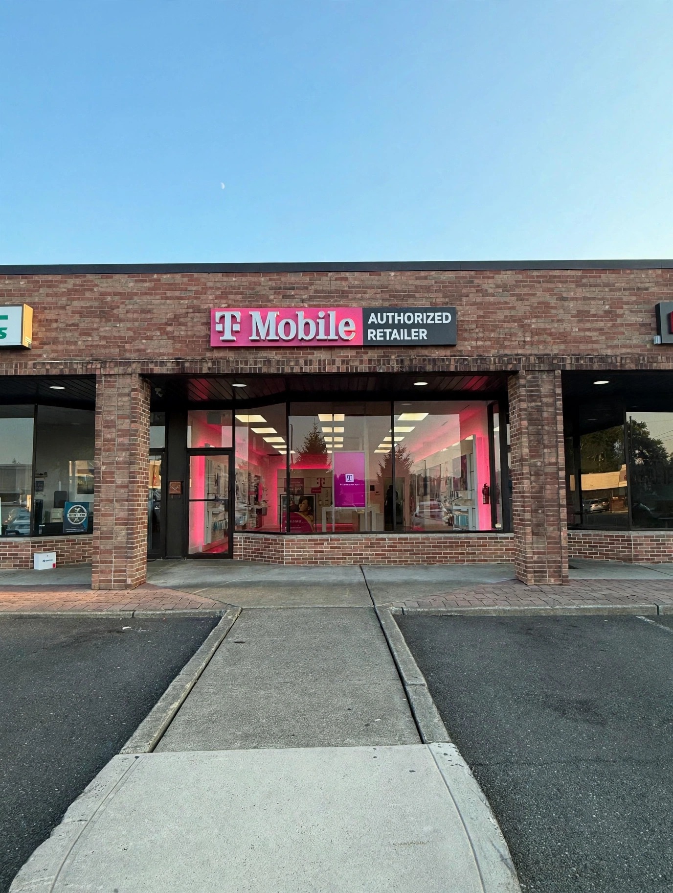 Retail storefront with illuminated signage and LED lighting